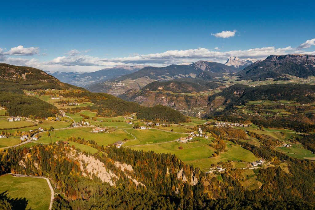 Renon Collalbo earth pyramids landscape autumn South Tyrol landscape Alpe di Siusi aerial view